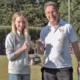 Jenny Moore holding the trophy with Rob Matthews